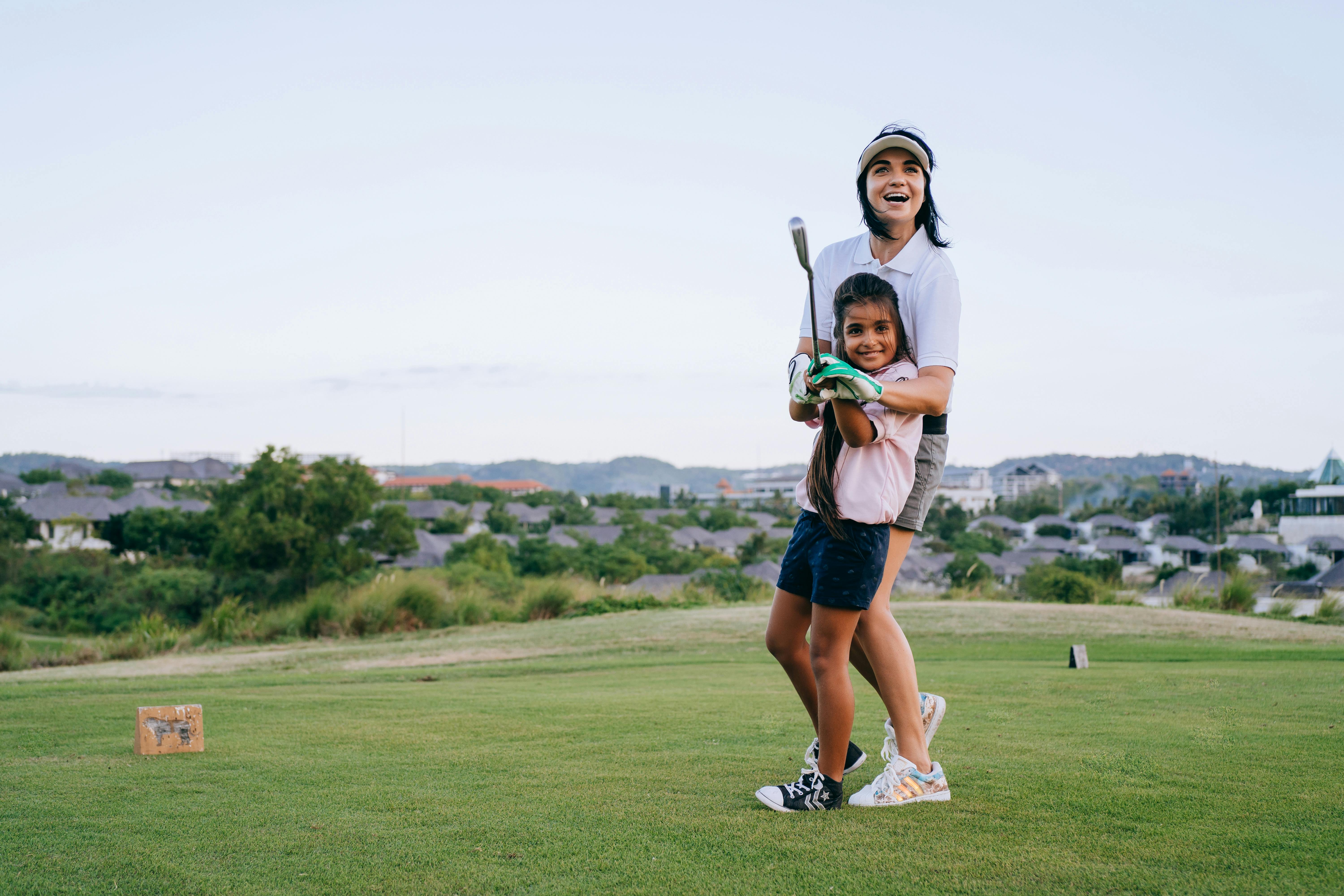 Mum helping child with activity to encourage parent participation